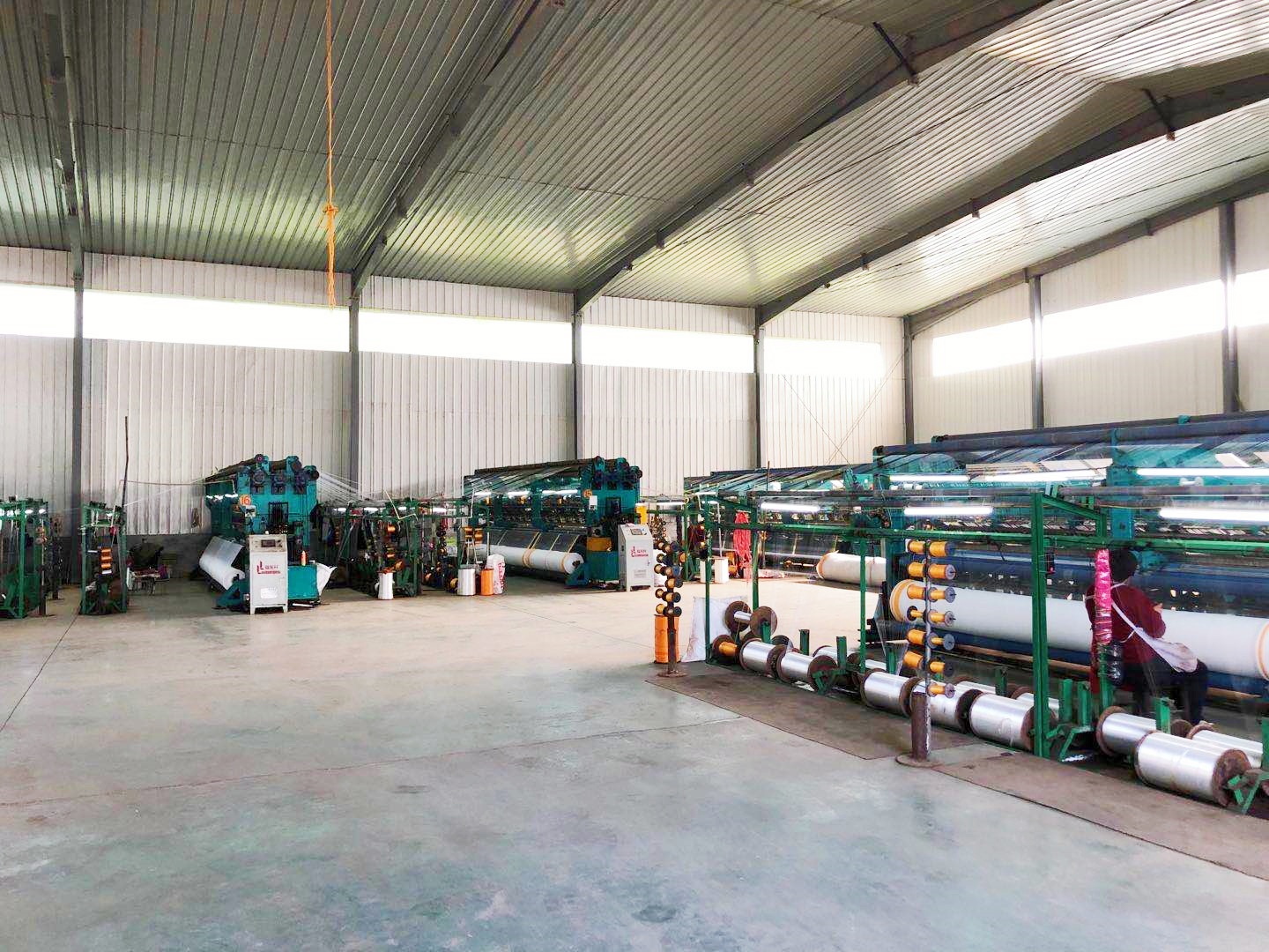Advanced warp knitting production lines with Karl Mayer machines manufacturing HDPE nets
